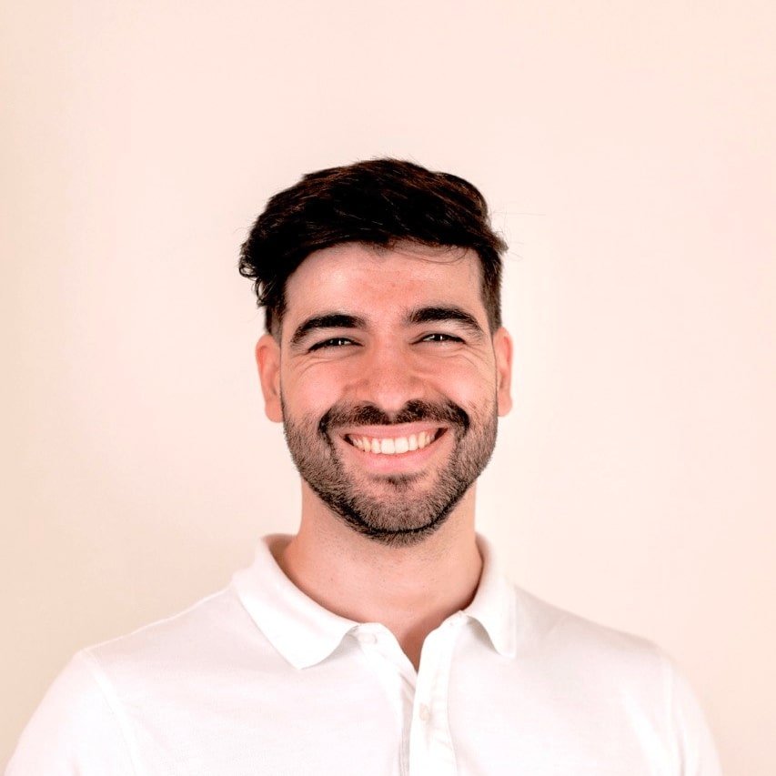 Daniel Azevedo smiling in a white shirt